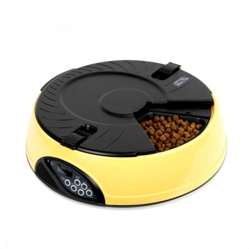 Yellow feeder with the black tray lid and one compartment open