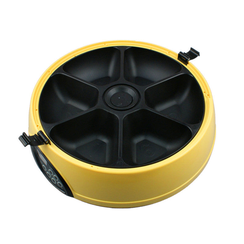 Yellow feeder with the six-compartment tray exposed