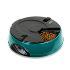 Teal feeder with one compartment open showing kibble