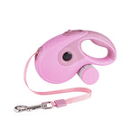 Pink retractable leash with the strap extended and clip