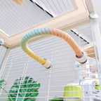 Pastel rope perch arched across the inside of a cage