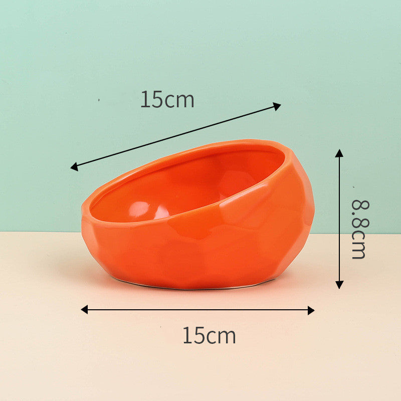 Orange slanted ceramic bowl, side view