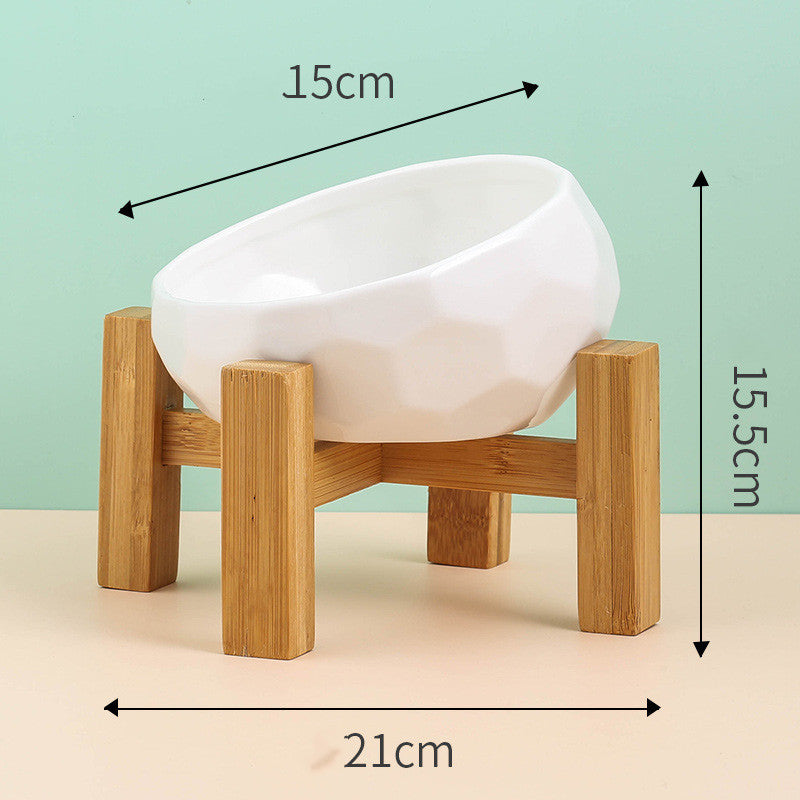 White bowl resting in its wooden stand
