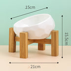 White bowl resting in its wooden stand