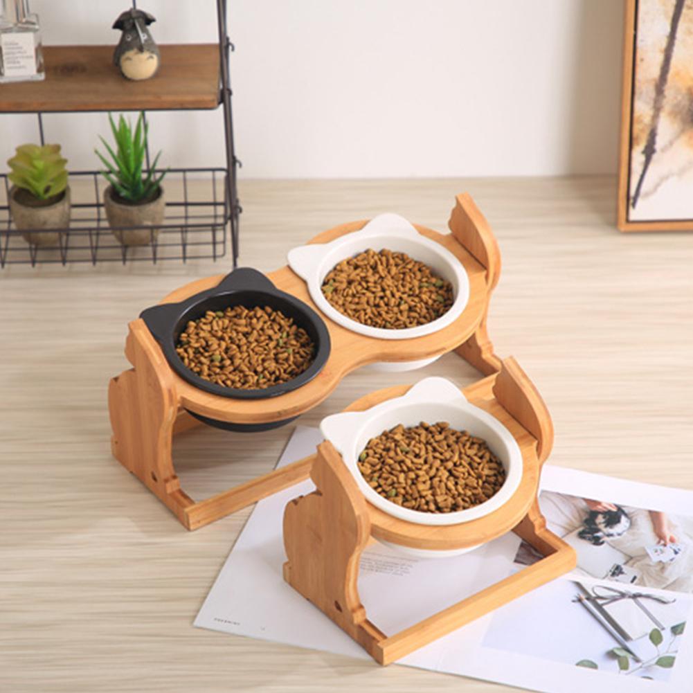 Double bowl stand holding food beside a single stand