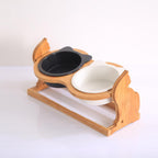 Double stand with one black and one white bowl