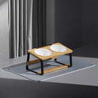 Stand with two bowls standing on a grey floor