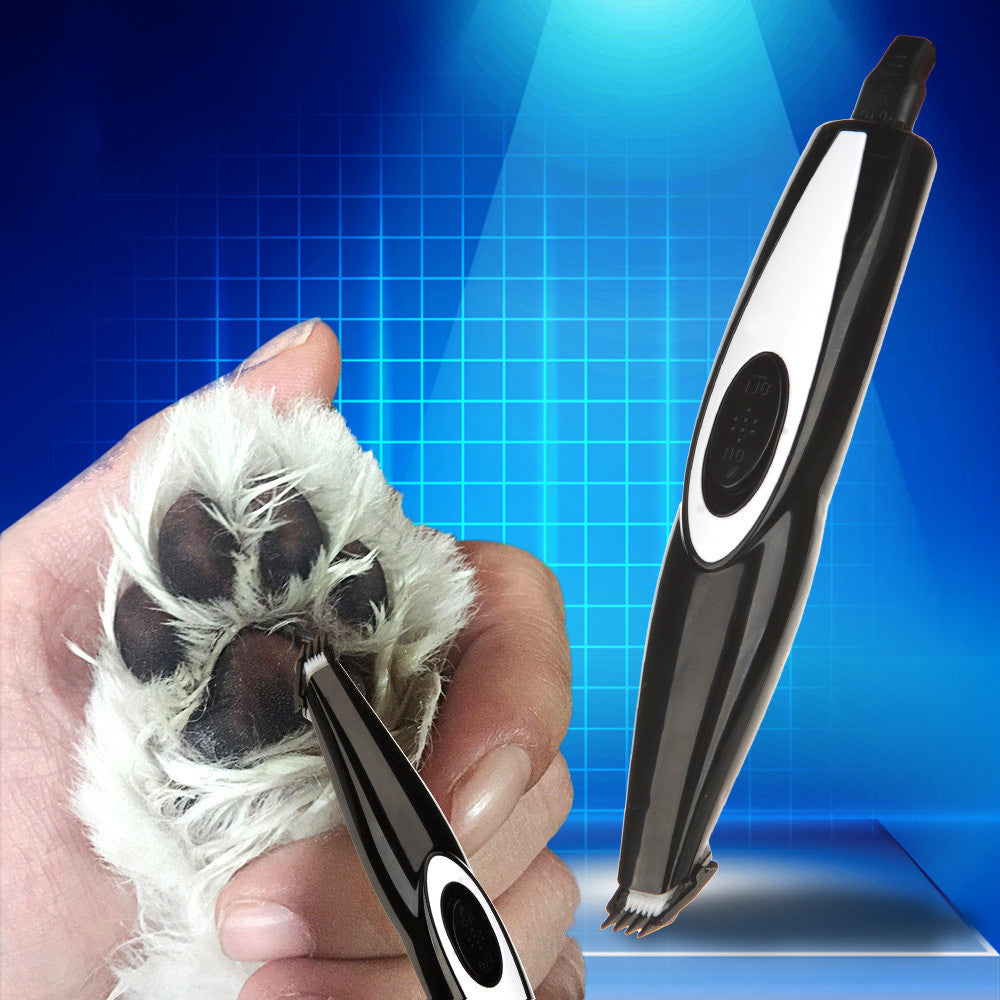 Hand trimming a dog's paw fur with the black clipper