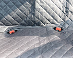 Close-up of the quilted grey fabric and seat belt openings