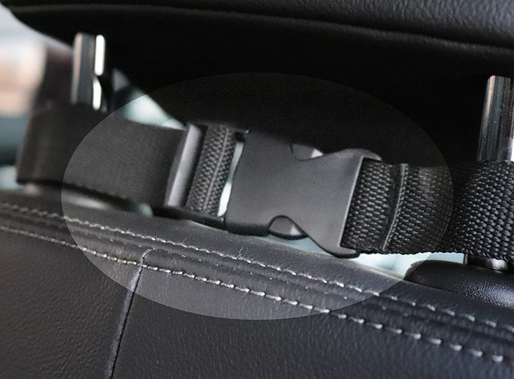 Close-up of the headrest strap buckled inside a car
