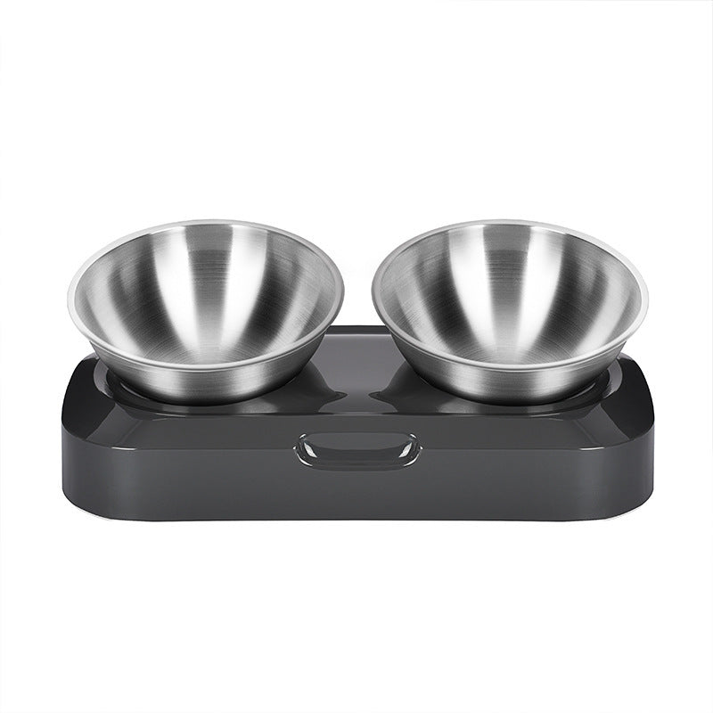 Two stainless steel bowls on a black tilted stand