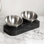Double bowl stand on a marble surface, angled view