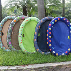 Five floats stacked on grass in different patterns