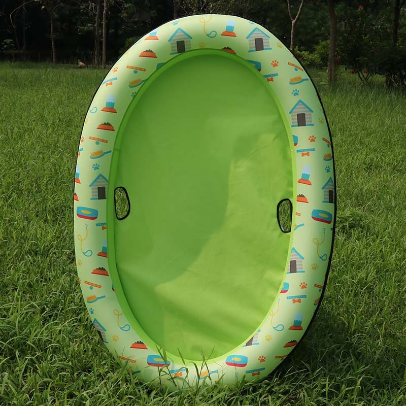Green float with a printed rim standing upright on grass