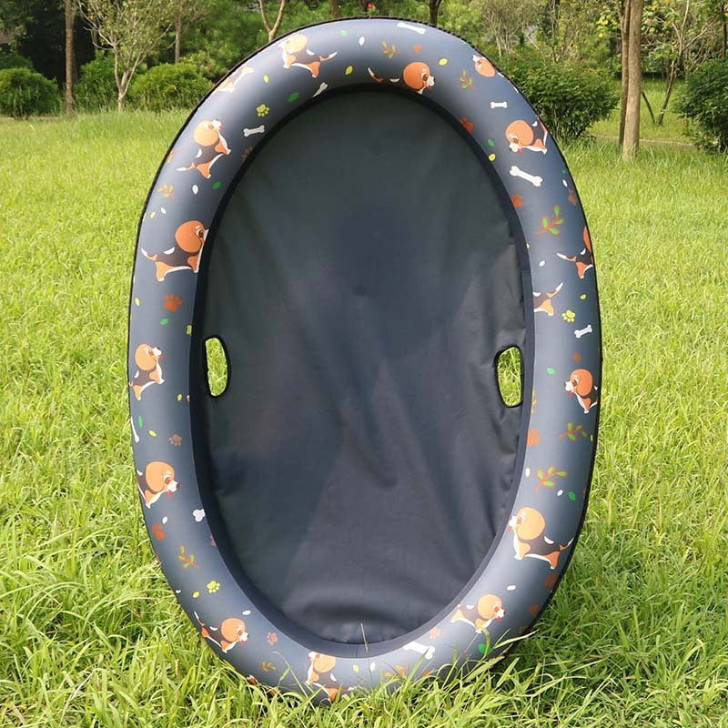 Grey float with an orange patterned rim on grass