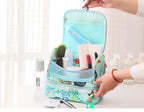 Bag opened showing bottles and brushes in the pockets