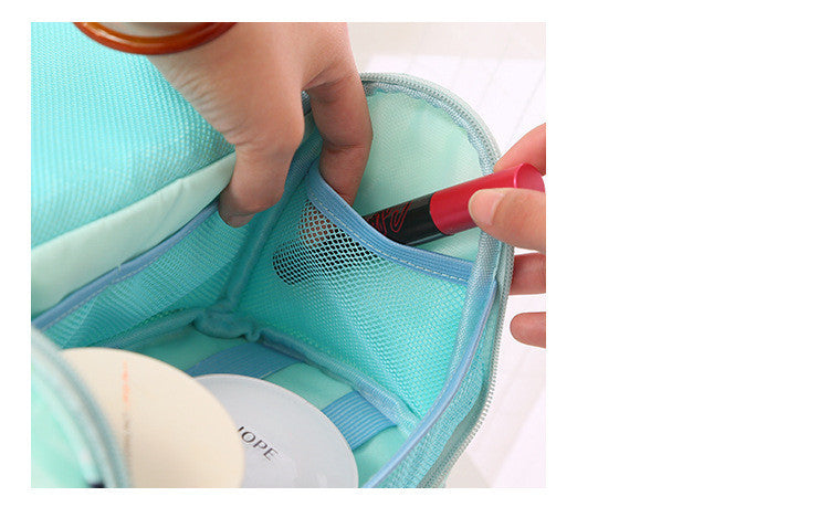 Hand taking an item out of the mesh pocket