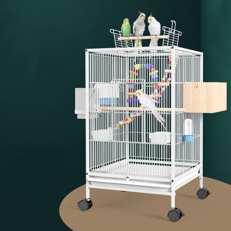 White cage with two cockatiels on the open play top