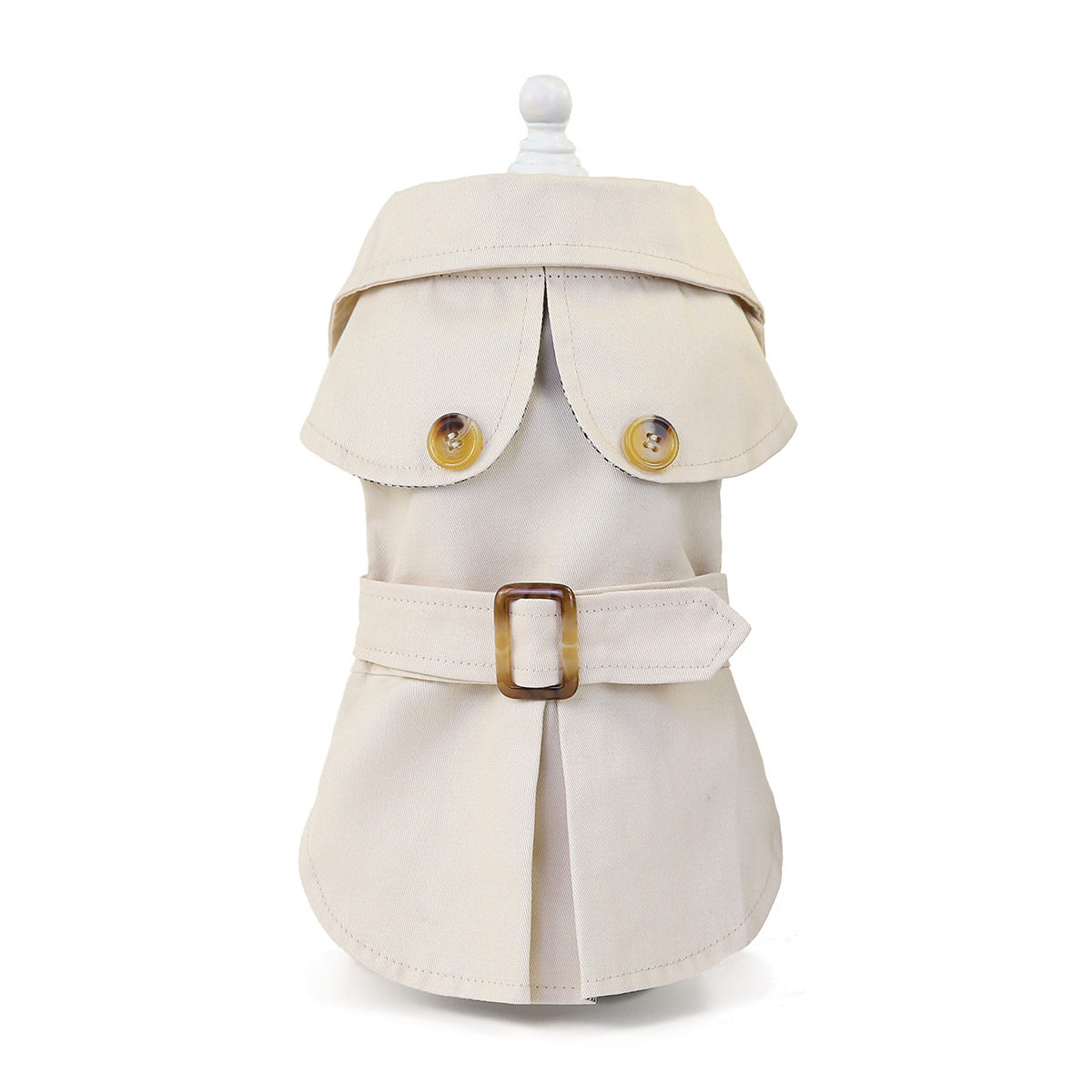 Cream coat on a mannequin with belt fastened