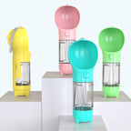 Four bottles in yellow, pink, blue and green on white pedestals