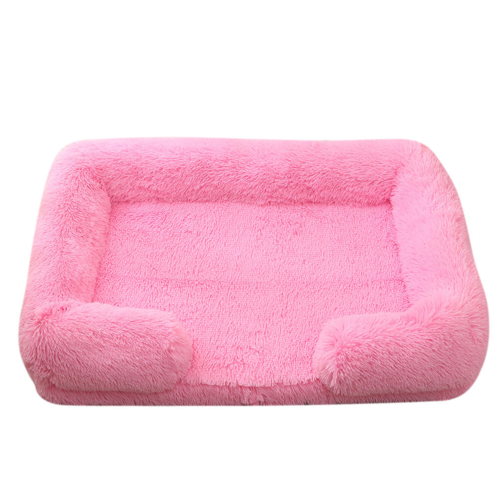 Bright pink plush sofa bed with raised bolster edge