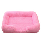 Bright pink plush sofa bed with raised bolster edge