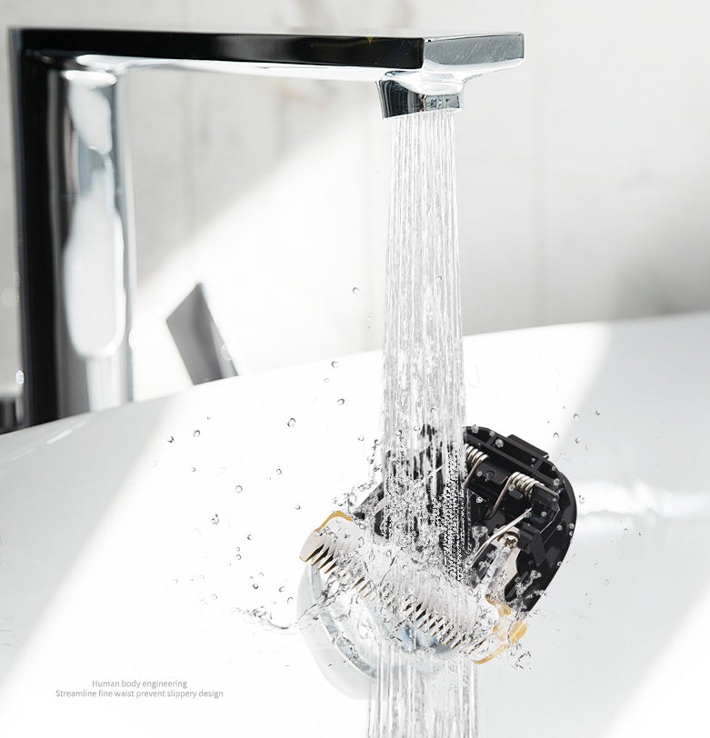 Clipper blade being rinsed under running water