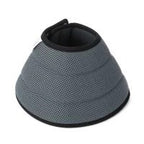 Grey recovery cone standing upright on white