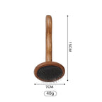 Small round slicker brush with a wooden handle