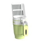 Green litter scoop with the bin unit attached